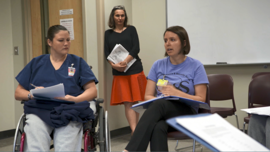 A University of Iowa student leads a group of women in the Healthy Relationships class at the Iowa Correctional Institute for Women.