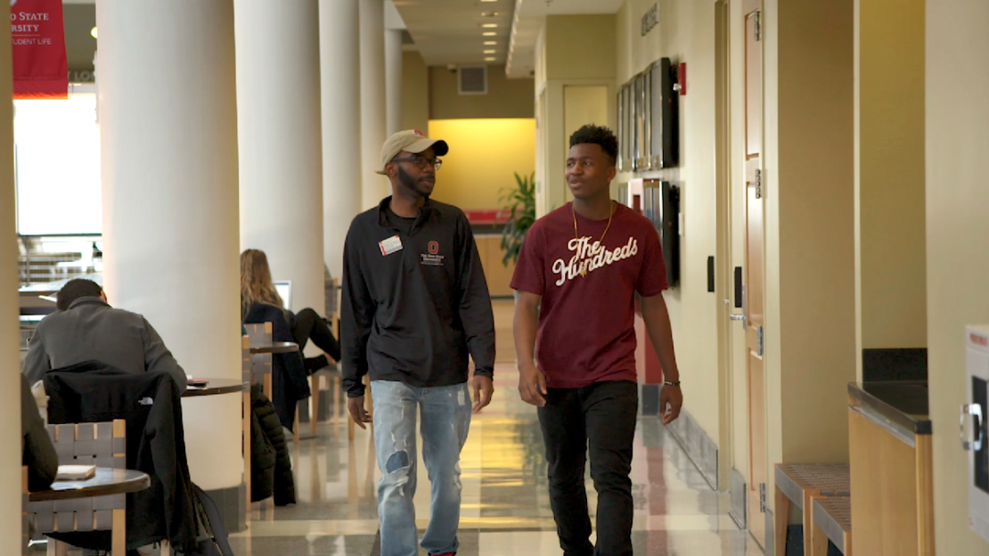 DaVonti' Haynes walking with a perspective student on the campus of the Ohio State University