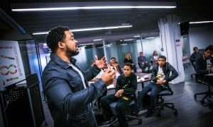 Neal Sales-Griffin in front of students at 1871 incubator in Chicago