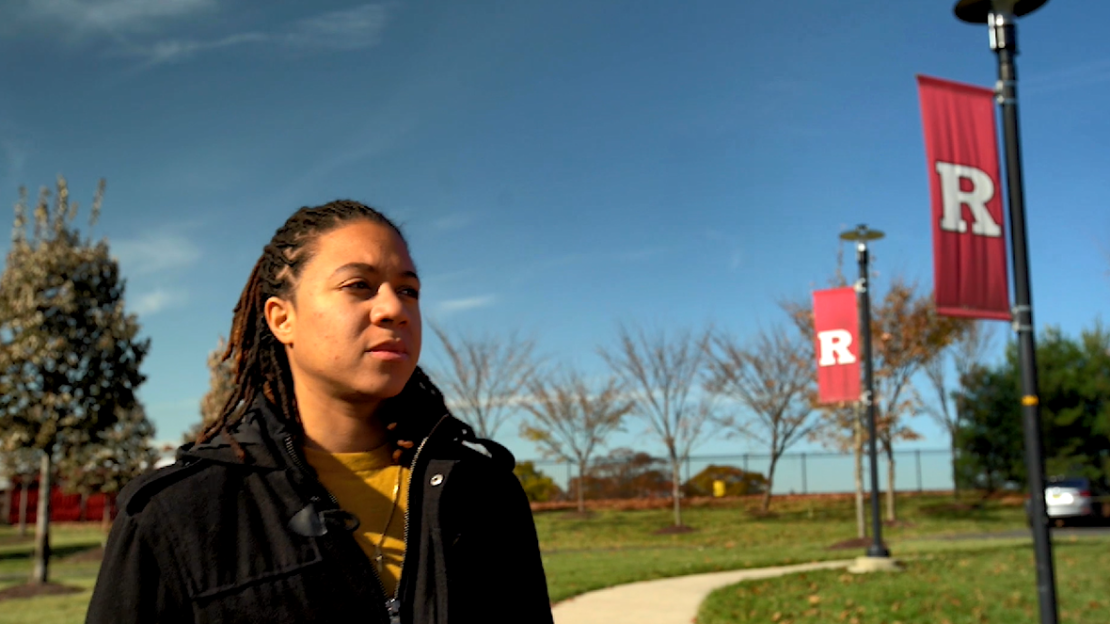 Rutgers University alumnae Danielle King walking on the New Brunswick campus