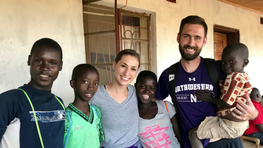 Northwestern University's Tad and Karly Glibert in Malawi with residents.