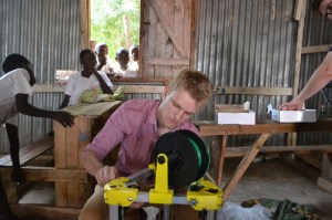 A Penn State student working with the Kijenzi printer.