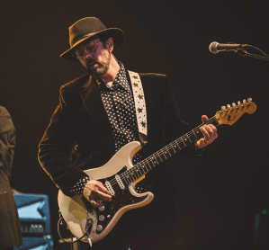 Indiana University alum and music producer Mark Plati playing guitar