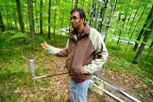 Ankur Desai, a University of Wisconsin Madison professor of atmospheric and oceanic sciences in front of a flux tower installed for a recent research project