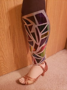 University of Iowa student and No Limbits founder Erica Cole's stained glass prosthetic leg cover.