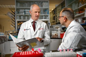 Ohio State Dr. Stephen Kolb, left, speaks with research scientist Mehmet Yalvac in Kolb?s lab inside Rightmire Hall.