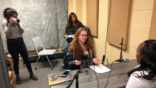 University of Michigan students conducting an interview for their podcast While We Were Away