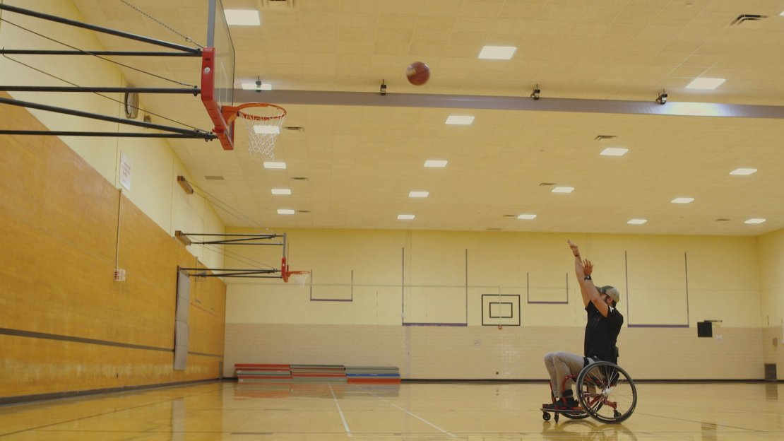 Evan David, president of the Indiana University Wheelchair Basketball Club shoots a free throw